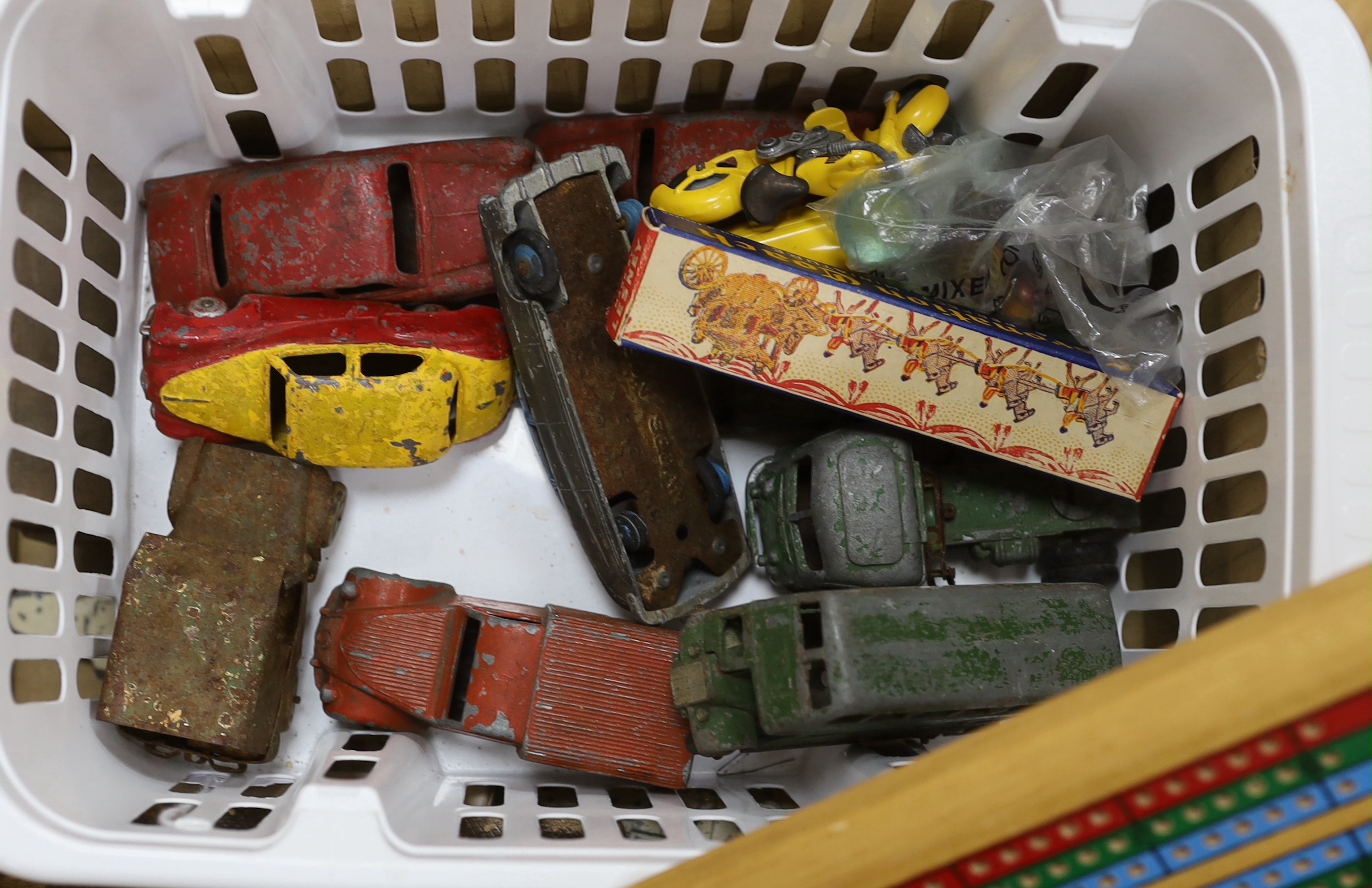 A quantity of toys including Dinky, Pelham puppet and cribbage board, the largest 38cm wide